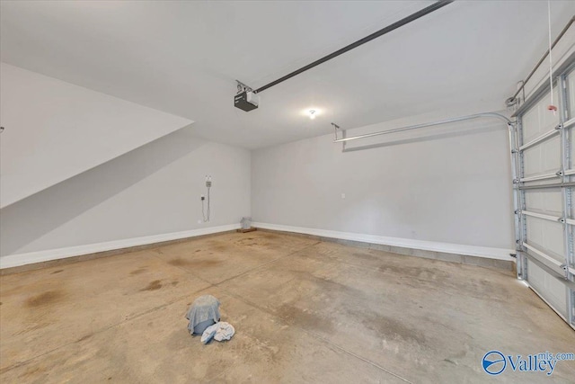 garage featuring baseboards and a garage door opener