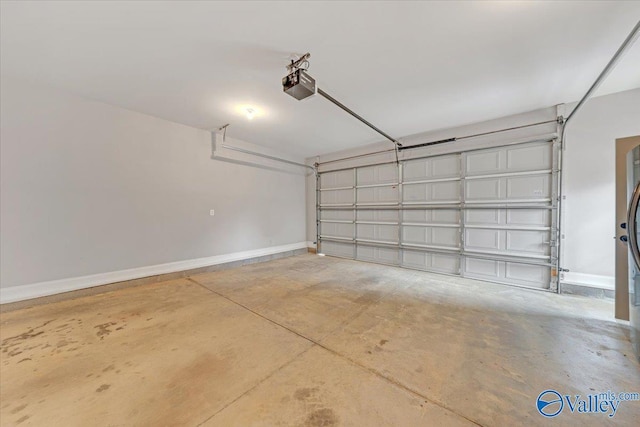 garage with baseboards and a garage door opener