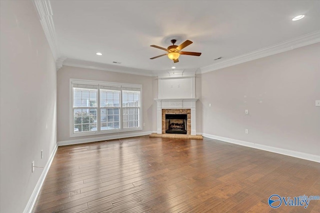 unfurnished living room featuring ceiling fan, crown molding, baseboards, and wood finished floors