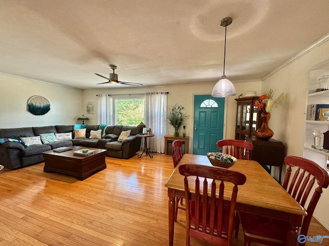 dining room featuring ceiling fan, light hardwood / wood-style floors, and crown molding