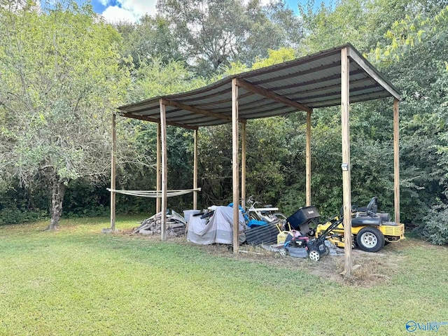 view of car parking with a carport and a lawn