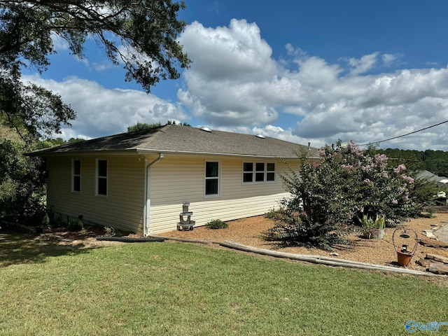 view of home's exterior featuring a lawn