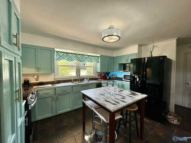 kitchen featuring green cabinets, black refrigerator with ice dispenser, and range with electric stovetop