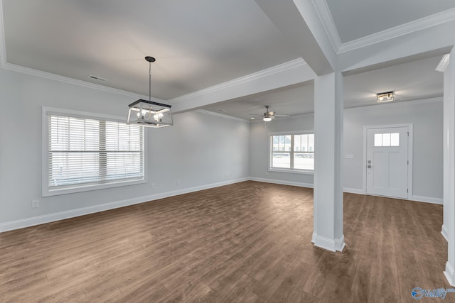 interior space featuring crown molding, visible vents, baseboards, and wood finished floors