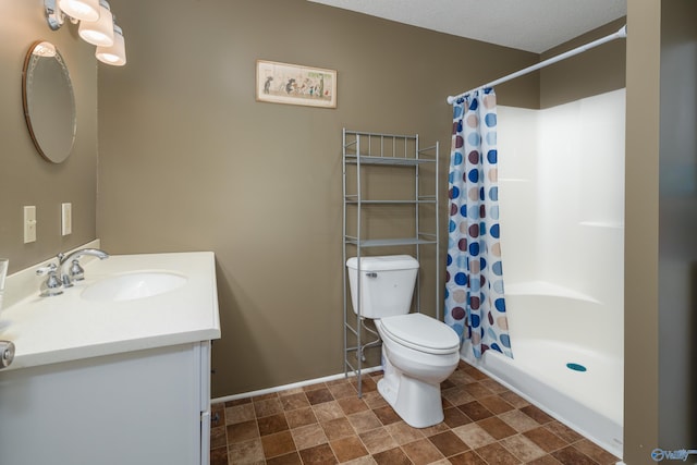 bathroom featuring vanity, tile patterned flooring, curtained shower, and toilet