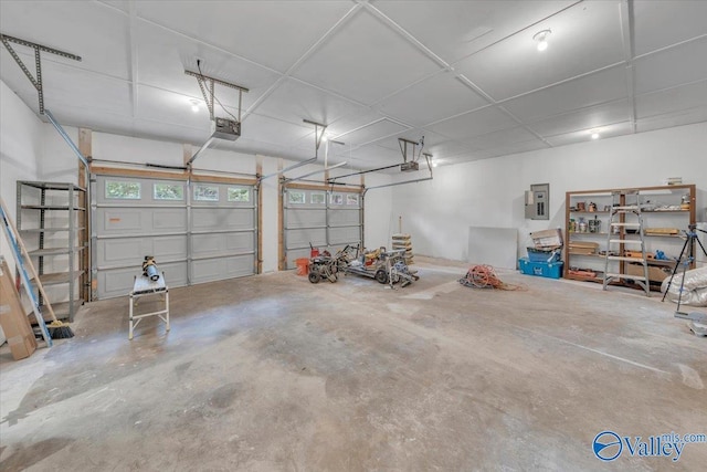 garage featuring a garage door opener and electric panel