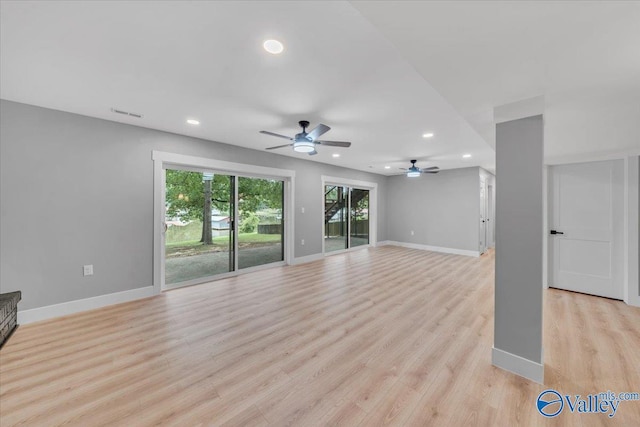 unfurnished living room featuring light wood finished floors, visible vents, baseboards, and recessed lighting