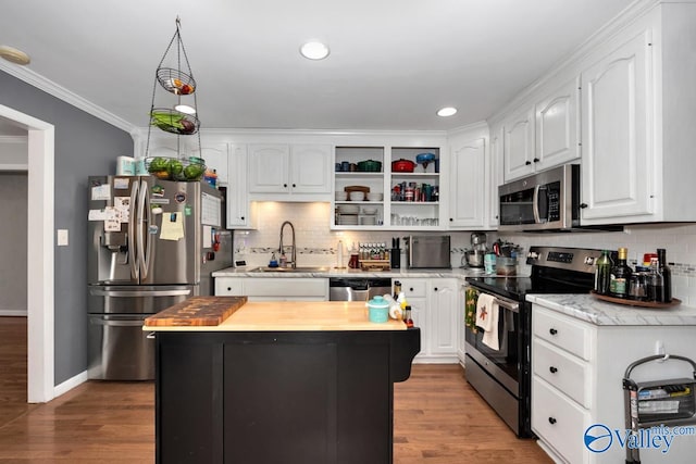 4315 Horace Dr NW, Huntsville, AL 35816 - kitchen with hardwood / wood-style floors, appliances with stainless steel finishes, white cabinetry, and sink
