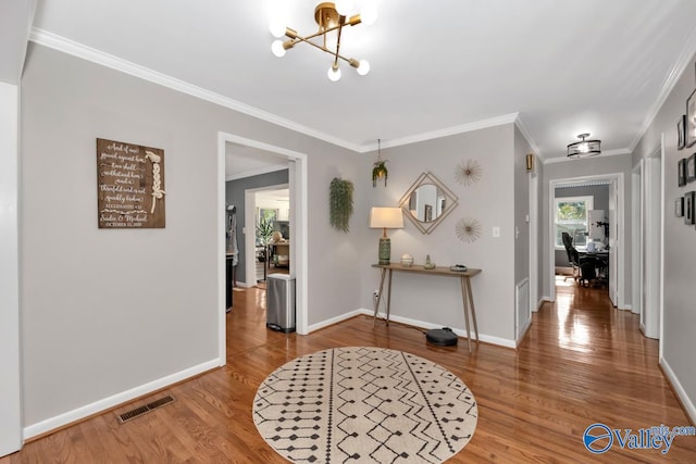 4315 Horace Dr NW, Huntsville, AL 35816 - entryway featuring crown molding, hardwood / wood-style floors, and an inviting chandelier