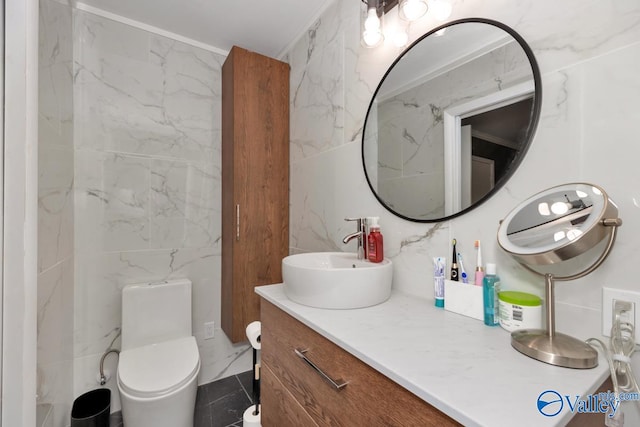 4315 Horace Dr NW, Huntsville, AL 35816 - bathroom featuring vanity, toilet, and tile walls