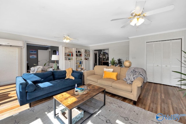 4315 Horace Dr NW, Huntsville, AL 35816 - living room with wood-type flooring, a wall mounted AC, crown molding, and ceiling fan