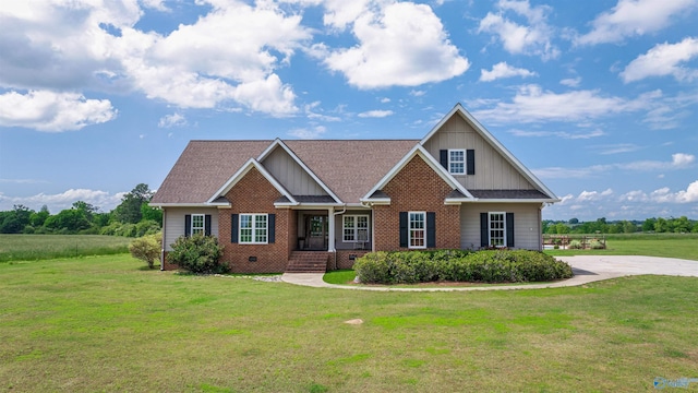 1635 County Road 47, Fyffe, AL 35971 - craftsman-style house with board and batten siding, brick siding, a front lawn, and a shingled roof