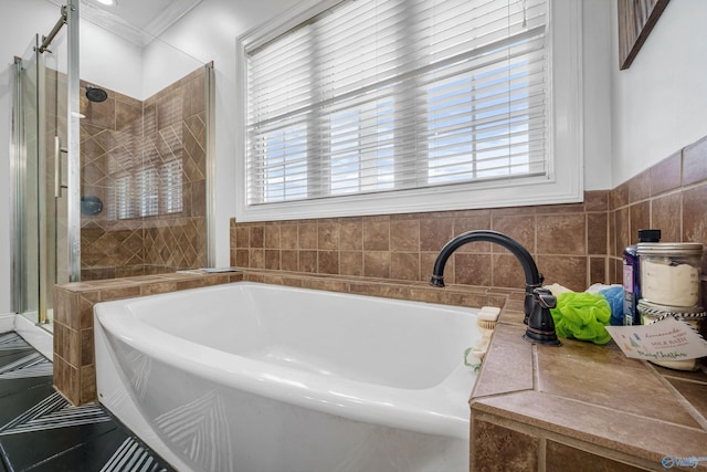 1635 County Road 47, Fyffe, AL 35971 - bathroom with a stall shower, a bath, and ornamental molding