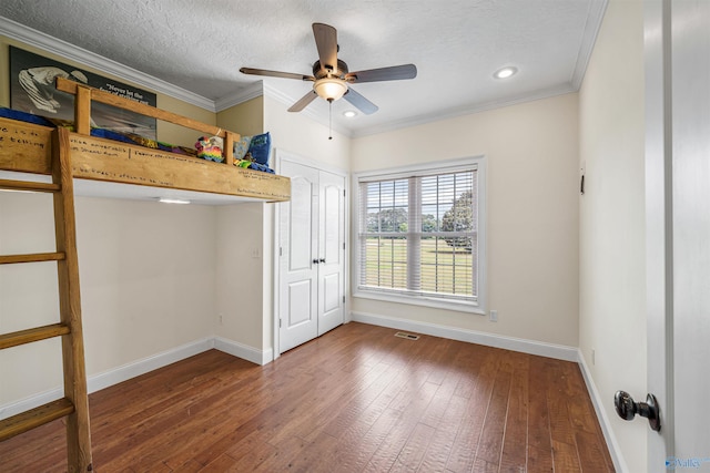 1635 County Road 47, Fyffe, AL 35971 - unfurnished bedroom with baseboards, hardwood / wood-style flooring, ornamental molding, recessed lighting, and a textured ceiling