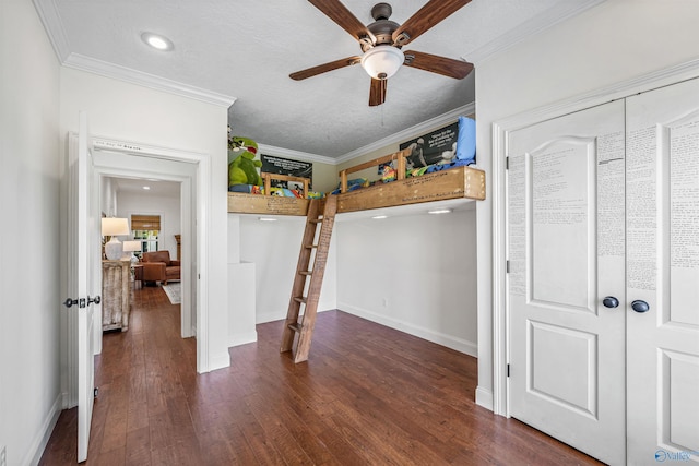1635 County Road 47, Fyffe, AL 35971 - unfurnished bedroom featuring wood finished floors, ornamental molding, baseboards, a closet, and a textured ceiling