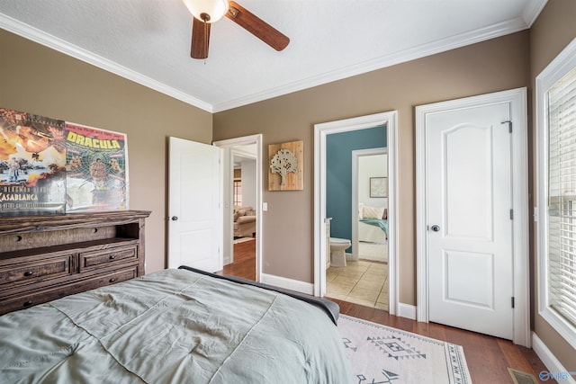 1635 County Road 47, Fyffe, AL 35971 - bedroom featuring ornamental molding, wood finished floors, ensuite bathroom, baseboards, and ceiling fan