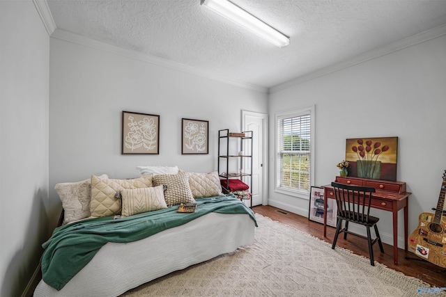 1635 County Road 47, Fyffe, AL 35971 - bedroom with crown molding, wood finished floors, a textured ceiling, and baseboards