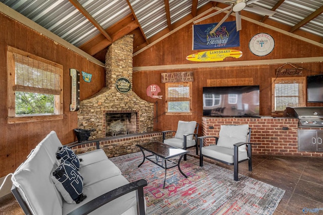 1635 County Road 47, Fyffe, AL 35971 - living area featuring a ceiling fan, wooden walls, a stone fireplace, and high vaulted ceiling