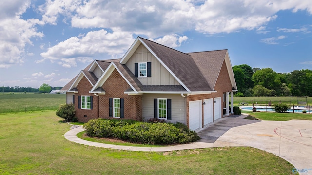 1635 County Road 47, Fyffe, AL 35971 - view of front of property with board and batten siding, concrete driveway, an attached garage, a shingled roof, and brick siding
