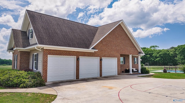 1635 County Road 47, Fyffe, AL 35971 - view of home's exterior with brick siding, concrete driveway, a shingled roof, and a garage
