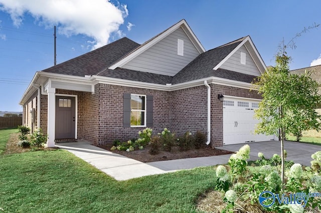 view of front of house featuring a garage and a front yard