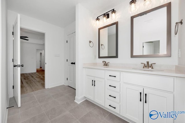 bathroom with tile patterned floors and vanity