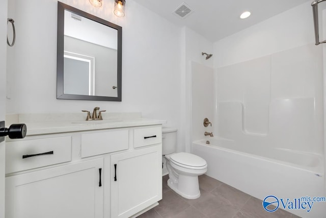 full bathroom with shower / bath combination, vanity, tile patterned flooring, and toilet