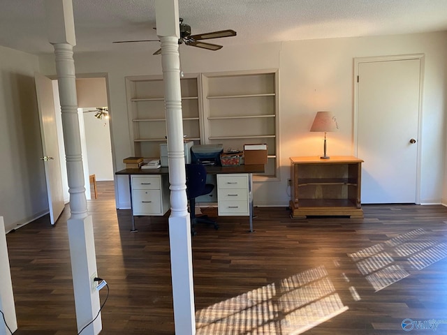 office space with ceiling fan, a textured ceiling, and dark hardwood / wood-style flooring