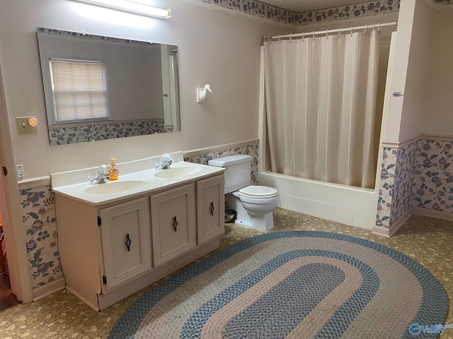 full bathroom with vanity, shower / bath combo with shower curtain, and toilet