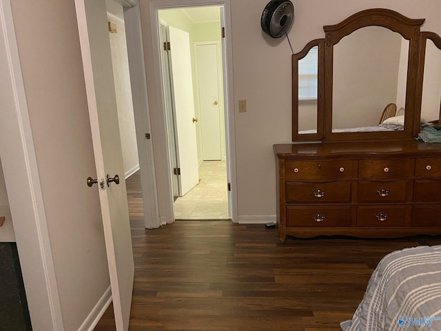 bedroom featuring dark hardwood / wood-style flooring