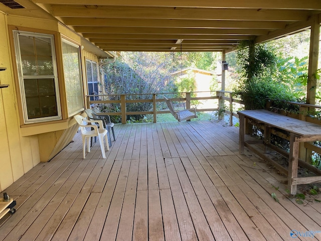 wooden terrace featuring visible vents