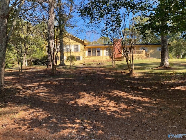 view of front of house featuring a wooden deck