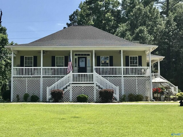 view of front of house with a porch and a front yard