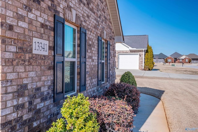 view of side of home featuring a garage