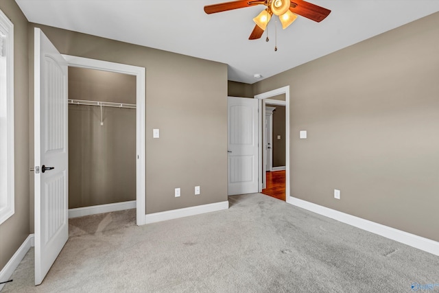 unfurnished bedroom with light carpet, a closet, and ceiling fan