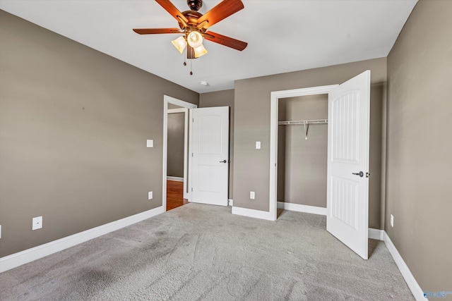 unfurnished bedroom featuring ceiling fan, light carpet, and a closet