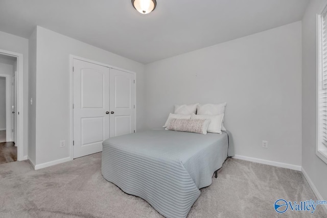 carpeted bedroom featuring a closet