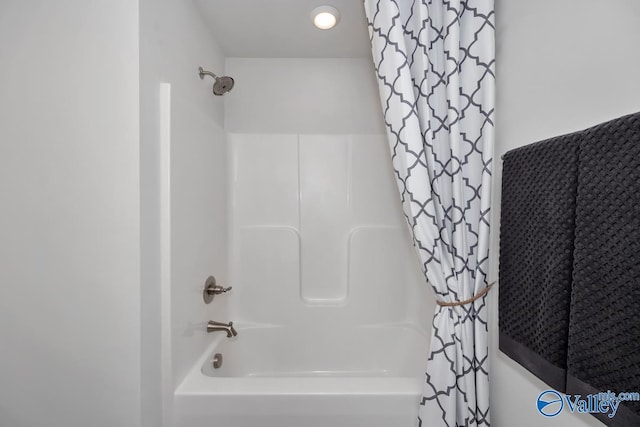 bathroom featuring shower / bath combo with shower curtain