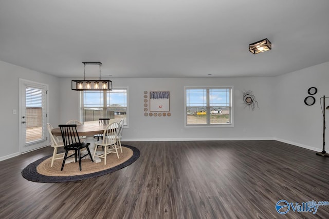 dining space featuring dark hardwood / wood-style flooring