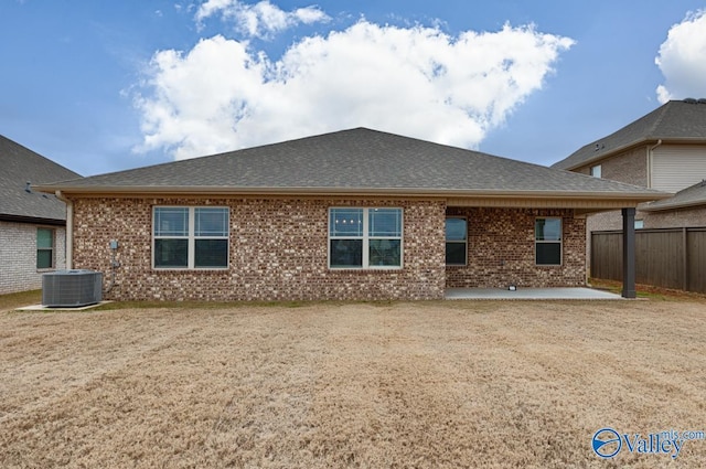 rear view of property with a patio area and cooling unit