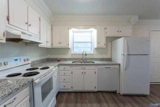 kitchen with light stone countertops, sink, white appliances, and white cabinetry