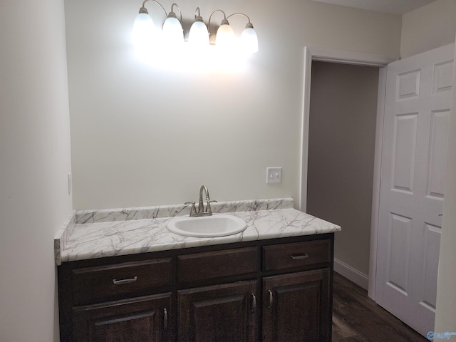 bathroom featuring vanity and hardwood / wood-style floors