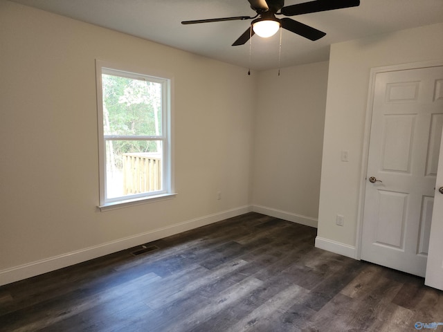 interior space with dark hardwood / wood-style floors and ceiling fan