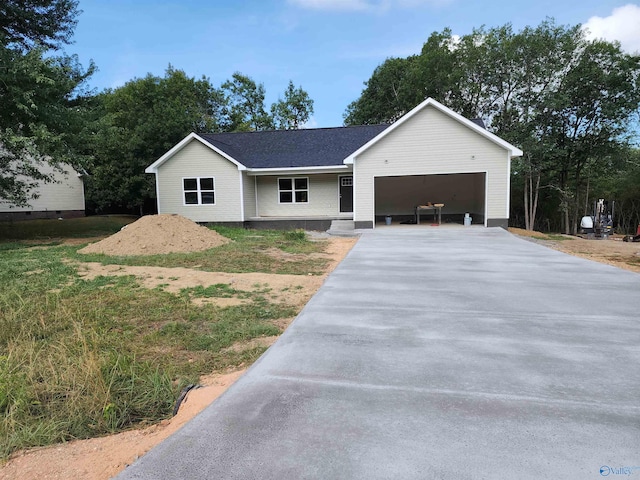 view of front of home with a garage and a front yard