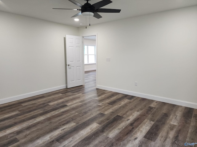 unfurnished room featuring dark hardwood / wood-style flooring and ceiling fan