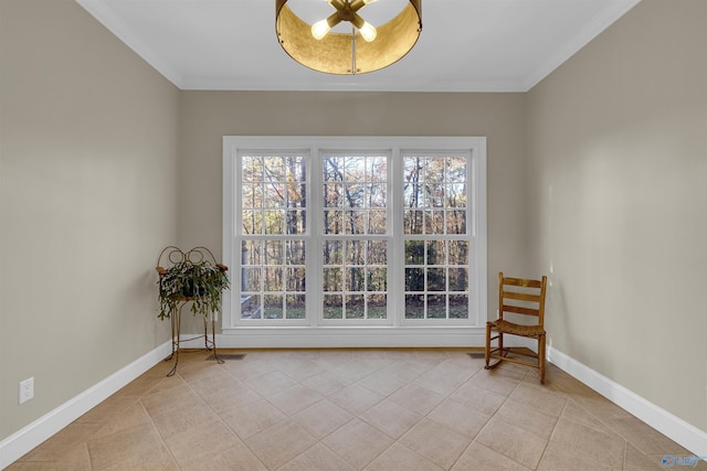 unfurnished room with ornamental molding and light tile patterned floors