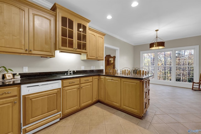 kitchen featuring white dishwasher, hanging light fixtures, sink, light tile patterned floors, and kitchen peninsula