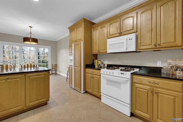 kitchen with dark stone counters, pendant lighting, white appliances, light tile patterned flooring, and ornamental molding