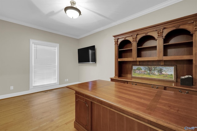 unfurnished office featuring light wood-type flooring and ornamental molding