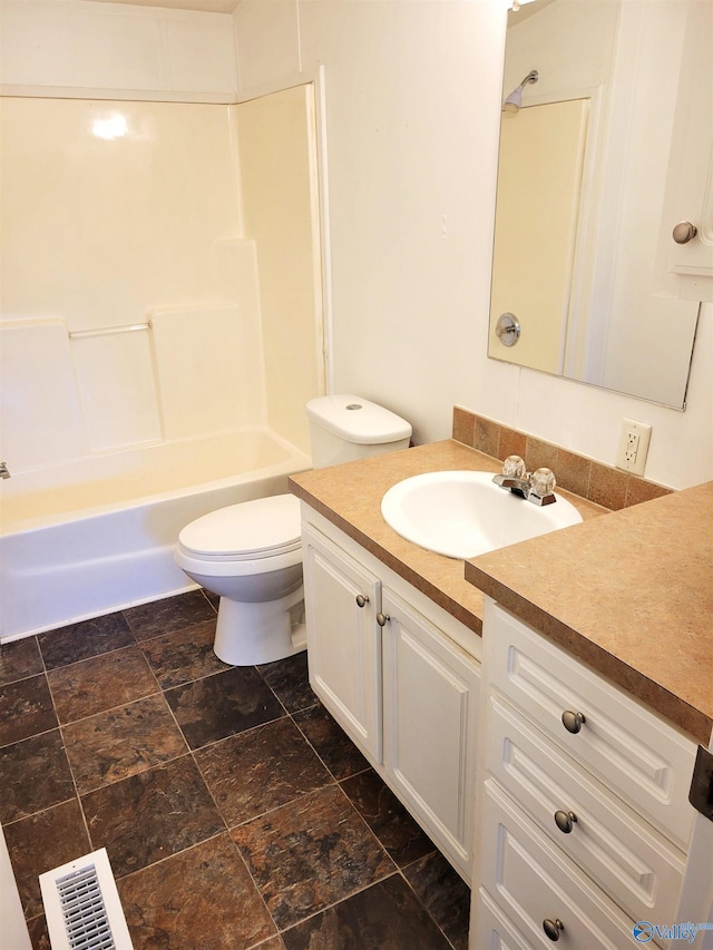 full bathroom featuring vanity,  shower combination, and toilet